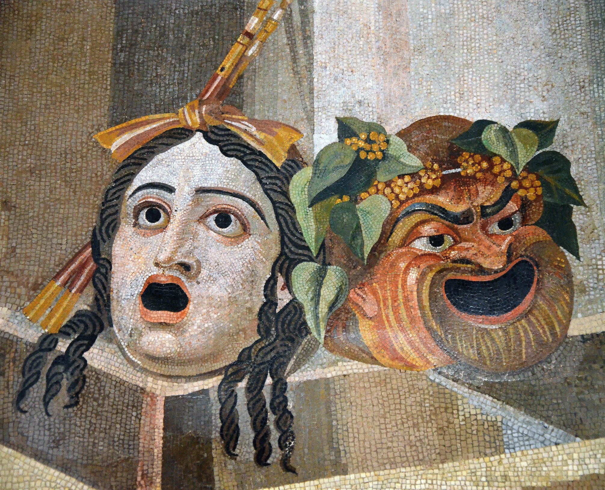 A tragédia és a komédia színházi maszkjai egy ókori római mozaikon (forrás: Wikipedia)